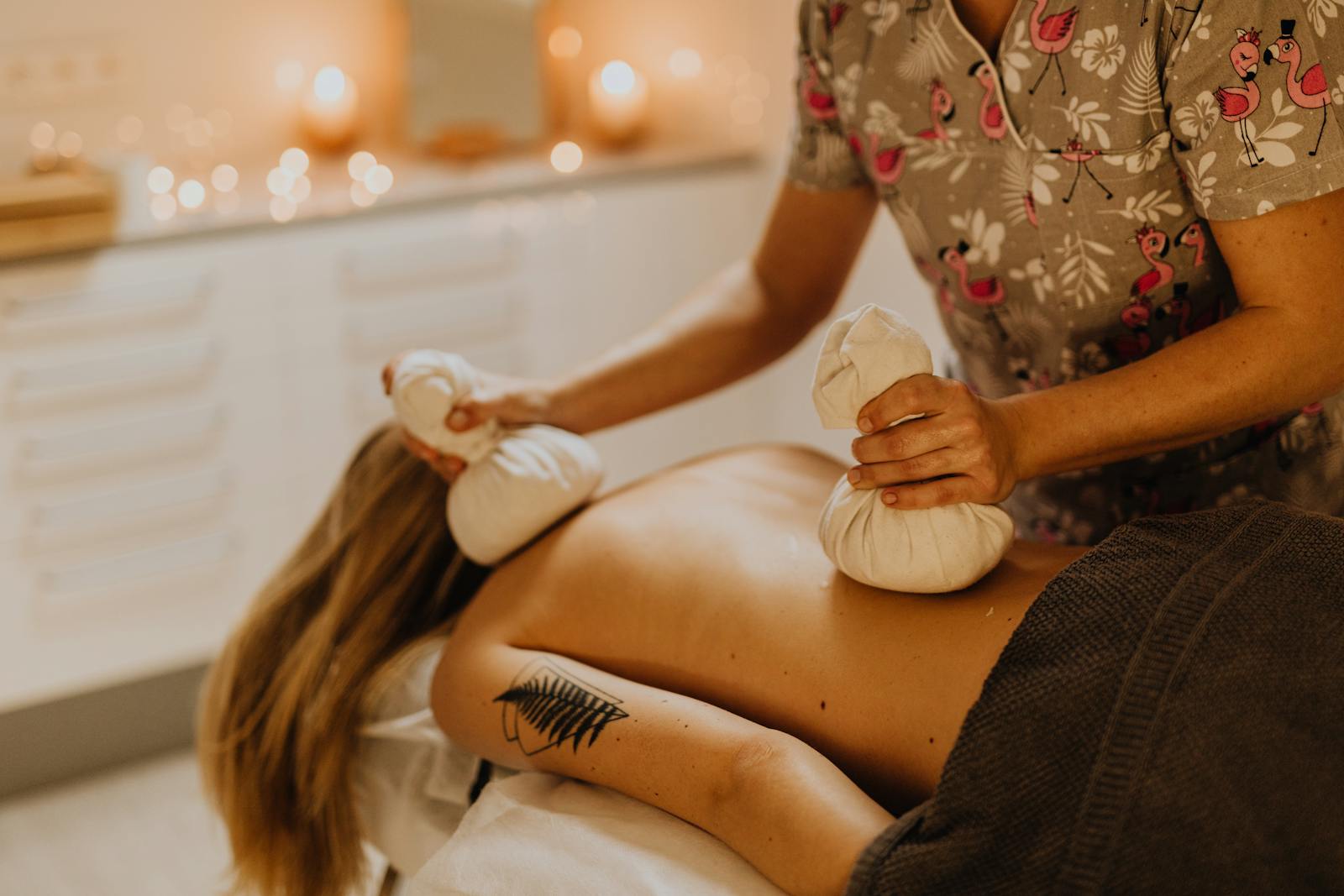 A Tattooed Woman Having a Massage